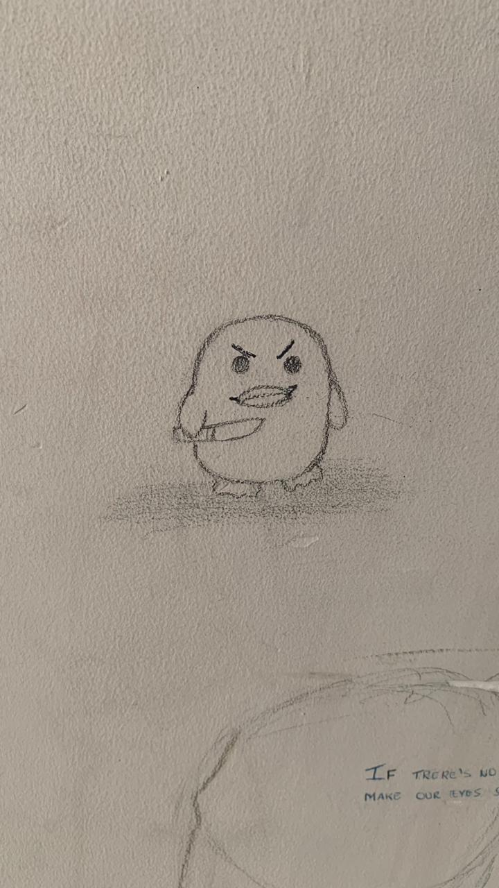 Desenho simples feito a lápis em uma parede clara. O desenho central é um pato arredondado e estilizado com uma expressão zangada ou ameaçadora, sobrancelhas franzidas e a boca serrilhada. O pato está segurando o que parece ser uma faca na mão direita. O desenho é sombreado com traços de lápis na base.